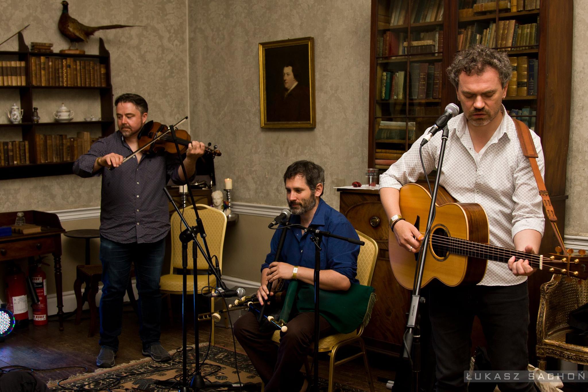 photo of an three men who are playing an Irish traditional music concert at Bellurgan Park in County Louth, Ireland